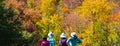 Algonquin Park, Canada - October 5, 2019: Four Oriental Women Looking at Fall Colors from Centennial Ridges Hiking Trail