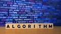 ALGORITHM message word on a wooden desk on cube blocks with a blue code software developer Royalty Free Stock Photo
