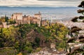 Alhambra castle on green hill at autumn. Old structures of Granada . View of historical town of Andalusia, Spain