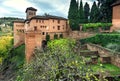 Alhambra castle walls over green hill, Granada. 14th century structures with trees in Andalusia, Spain Royalty Free Stock Photo