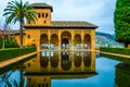 Alhambra de Granada. El Partal. A large central pond faces the arched portico behind which stands the Tower of the Royalty Free Stock Photo