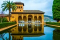 Alhambra de Granada. El Partal. A large central pond faces the arched portico behind which stands the Tower of the Royalty Free Stock Photo