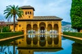 Alhambra de Granada. El Partal. A large central pond faces the arched portico behind which stands the Tower of the Royalty Free Stock Photo