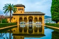 Alhambra de Granada. El Partal. A large central pond faces the arched portico behind which stands the Tower of the Royalty Free Stock Photo