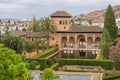 View at the Partal Palace or Palacio del Partal , a palatial structure around gardens and water lake inside the Alhambra fortress Royalty Free Stock Photo