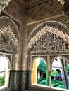 Alhambra in Granada, windows, arch and garden