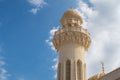 Ali Musa Mosque marble and sandstone minaret against blue sky, Old Muscat, Oman Royalty Free Stock Photo