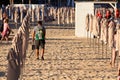 ALIACNTE, SPAIN, CIRCA JULY 2018 men with a metal detector at the beach