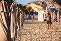 ALIACNTE, SPAIN, CIRCA JULY 2018 men with a metal detector at the beach