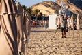 ALIACNTE, SPAIN, CIRCA JULY 2018 men with a metal detector at the beach