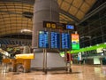 Alicante airport interior, showing the departure waiting area and timetable for flight gates.