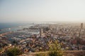 Alicante city and port panorama in haze at sunset in Septembe Royalty Free Stock Photo