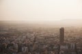 Alicante city and port panorama in haze at sunset in September, lonely bird flies Royalty Free Stock Photo