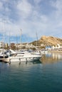 Alicante Port d`Alacant marina with boats and view of castle Castillo travel traveling holidays vacation portrait format in Spain