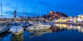 Alicante Port d`Alacant marina with boats and view of castle Castillo twilight travel traveling holidays vacation panorama in Royalty Free Stock Photo