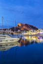 Alicante Port d`Alacant marina with boats and view of castle Castillo twilight travel traveling holidays vacation portrait format