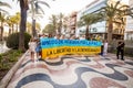 ALICANTE, SPAIN - AUGUST 24 2023: Ukrainians on march with giant blue-yellow flag. Celebration of Ukrainian Independence day,