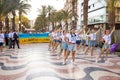 ALICANTE, SPAIN - AUGUST 24 2023: Ukrainians on march with giant blue-yellow flag. Celebration of Ukrainian Independence day,