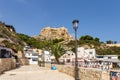 ALICANTE, SPAIN - JULY, 5 2023: Barrio Santa Cruz with Santa Barbara castle on background