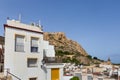 ALICANTE, SPAIN - JULY, 5 2023: Barrio Santa Cruz with Santa Barbara castle on background