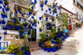 ALICANTE, SPAIN - JULY, 5 2023: House with blue pots in Santa Cruz district. Patio with flowers and plants in blue pots Royalty Free Stock Photo