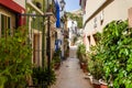 ALICANTE, SPAIN - JULY, 5 2023: Narrow street in Barrio Santa Cruz in Alicante, Costa Blanca, Spain