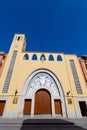 ALICANTE, SPAIN - JULY 5 2023: Building of the modern church, city street. Church facade, green trees, christian church