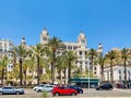 ALICANTE, SPAIN - JULY, 5 2023 - Famous building Casa Carbonell, tourist destination. Palms and cars, central street in Alicante