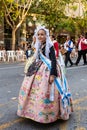 ALICANTE, SPAIN - JUNE 25 2023: Girl walking in march in raditional spanish dress, hogueras San Juan festival Royalty Free Stock Photo