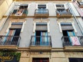 ALICANTE, SPAIN - JUNE 3, 2023: Traditional balconies, ancient building in downtown of Alicante. Balconies with forged metal