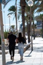 People walking along the Paseo Maritimo de San Juan in Alicante in 2022 Royalty Free Stock Photo