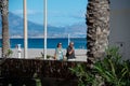 People walking along the Paseo Maritimo de San Juan in Alicante in 2022 Royalty Free Stock Photo