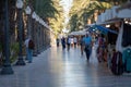 People walking on the Paseo Maritimo in the touristic city of Alicante in Spain in 2022 Royalty Free Stock Photo