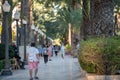 People walking on the Paseo Maritimo in the touristic city of Alicante in Spain in 2022 Royalty Free Stock Photo