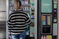 Alicante, Spain October 4, 2023: Employee Comfort. A Rear View of a Worker Selecting Their Favorite Coffee or Snack at the