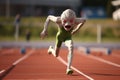 alien athlete speeding past the finish line in track and field event