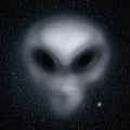 Alien blurred face against a starry background