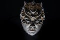 Alien, demon, sorcerer makeup. Head with thorns or warts, face covered with glitters, close up. Fantasy concept. Demon