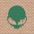 Alien face illustration in brick wall Royalty Free Stock Photo