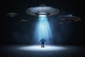 Alien invasion concept. Man standing under light beam from flying UFO spaceship. 3D rendered illustration Royalty Free Stock Photo