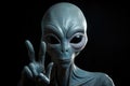 Alien is showing a peace sign with his hand Royalty Free Stock Photo