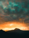 Alien sky during a sunset. Mountains