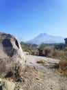 Alien stone view with merapi& x27;s mountain at the background Royalty Free Stock Photo