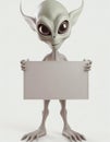 Alien visitor holding blank sign Royalty Free Stock Photo