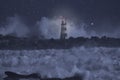 Alight beacon in a stormy sea at night Royalty Free Stock Photo
