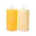 Alight color wax candles on white Royalty Free Stock Photo