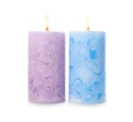 Alight color wax candles on white Royalty Free Stock Photo