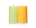 Alight color wax candles on white Royalty Free Stock Photo