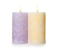 Alight color wax candles on white Royalty Free Stock Photo