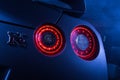 Alight rear lights Nissan GT-R in the dark garage Royalty Free Stock Photo